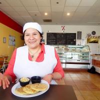 Xinia's Bakery Xinia's Bakery, Xinia Cruz, owner with pupusas