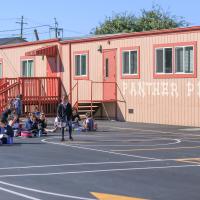 St. Paul School photo of children in front of mural