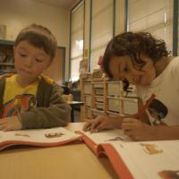 St. Paul School photo of children coloring in books 