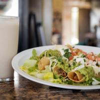 Taqueria Doña Maria delicious plate of enchiladas with green sauce
